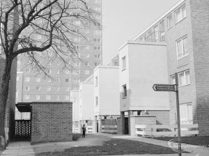 Becontree Heath housing, with white rectangular two-storey features and public footpath signpost to Trefgarne Road, 1972