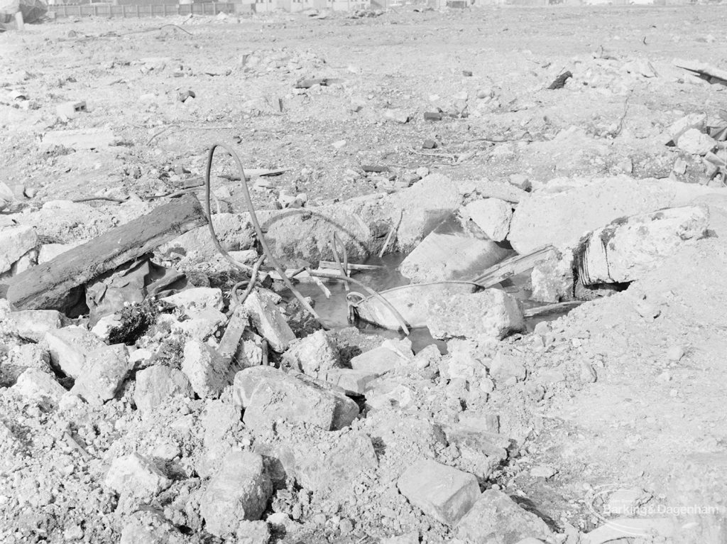 Borough Engineer’s Department clearance of site at Lindsell Road, Barking (Gascoigne 4, Stage 2), showing pipe and other debris in centre of site, 1972