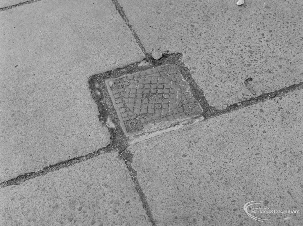 Highways, showing small metal cover in pavement outside Police Station, Ripple Road, Barking, with 2p coin to give sense of scale, 1972