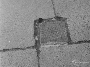 Highways, showing small metal cover in pavement outside Police Station, Ripple Road, Barking, with 2p coin to give sense of scale, 1972