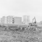 Borough Engineer’s Department clearance of site at Lindsell Road, Barking (Gascoigne 4, Stage 2), showing protruding concrete blocks and earth mover, 1972