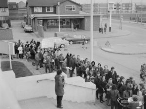 Public meeting on ‘Fair Rents’ bill at Assembly Hall, Barking, showing large queue of protesting marchers at foot of Hall steps, with Captain Cook Public House in background, 1972