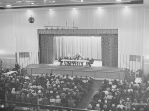 Public meeting on ‘Fair Rents’ bill at Assembly Hall, Barking, showing section of audience and stage with speaker, 1972