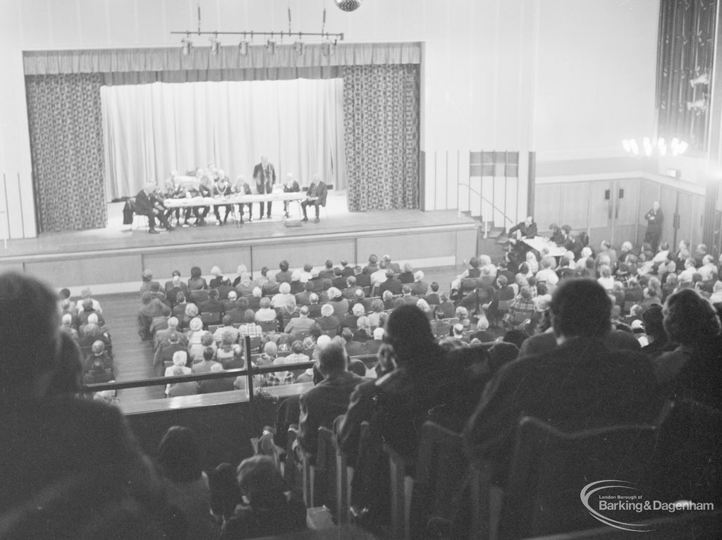 Public meeting on ‘Fair Rents’ bill at Assembly Hall, Barking, showing section of audience and stage with speaker, 1972
