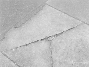 Defective paving stones outside garage in Ripple Road (subject of complaint), with 2p coin to give sense of scale, 1972