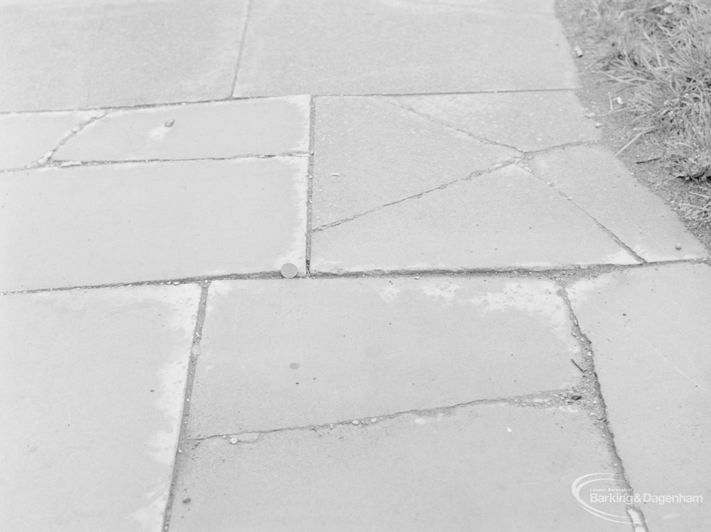 Defective paving stones outside garage in Ripple Road (subject of complaint), with 2p coin to give sense of scale, 1972