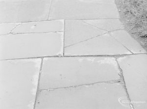 Defective paving stones outside garage in Ripple Road (subject of complaint), with 2p coin to give sense of scale, 1972