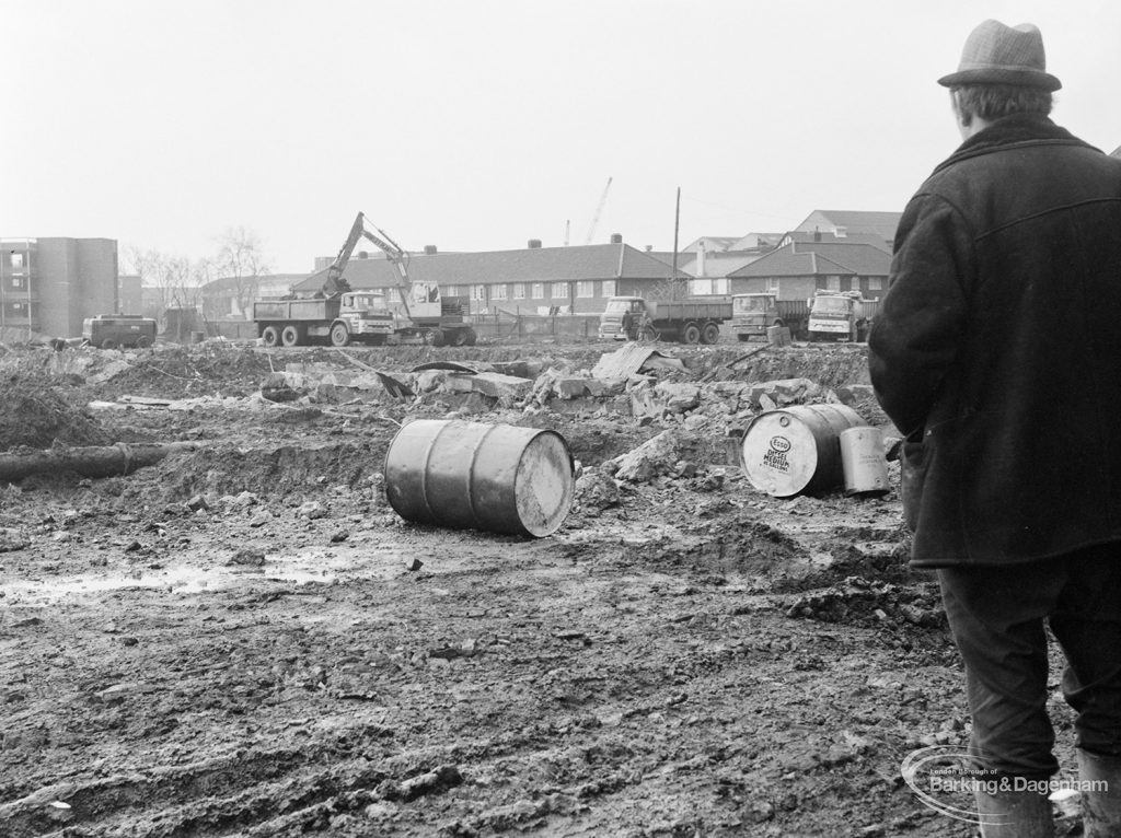 Borough Engineer’s Department clearance of site at Lindsell Road, Barking (Gascoigne 4, Stage 2), showing foreman watching small dynamite explosion, 1972