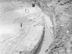 Borough Engineer’s Department clearance of site at Lindsell Road, Barking (Gascoigne 4, Stage 2), showing ditch and west edge of large circular concrete base, 1972