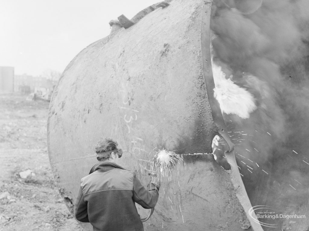 Borough Engineer’s Department clearance of site at Lindsell Road, Barking (Gascoigne 4, Stage 2), showing cutting of large cauldron for removal, 1972