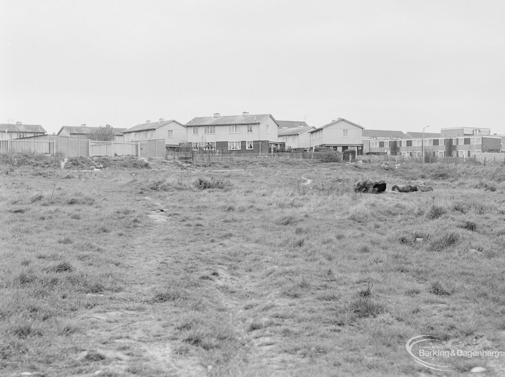 Dagenham Village housing development, showing undeveloped land adjoining east end of Ballards Road, continuing to south, with varied housing on horizon, 1972