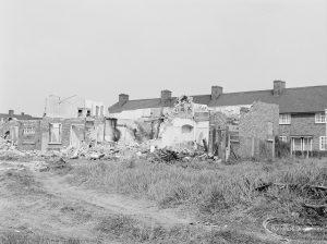 Housing development at Moss Road, Dagenham, showing half-demolished houses from east, 1972