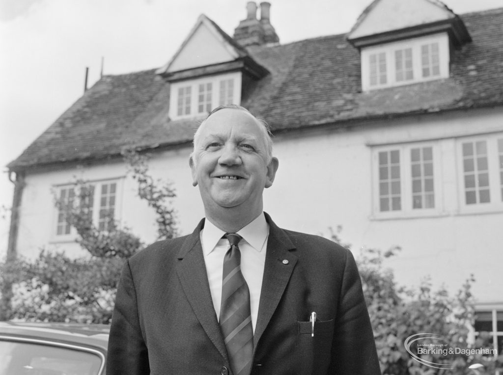 London Borough of Barking Borough Librarian Mr E W McManus FLA outside Valence House and smiling, 1972