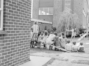 Welfare Department, taken for Social Services Dagenham Town Show display, showing children on a ladder and sitting on grass, 1972