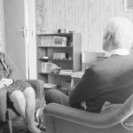Welfare Department, showing three people sitting in room and talking [possibly in Barking or Dagenham], 1972