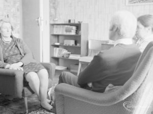 Welfare Department, showing three people sitting in room and talking [possibly in Barking or Dagenham], 1972