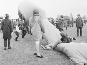 Dagenham Town Show 1972 at Central Park, Dagenham, showing children playing with giant inflated tube, 1972