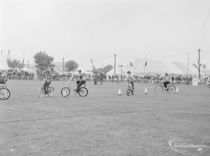 Dagenham Town Show 1972 at Central Park, Dagenham, showing display cyclists crossing arena, 1972