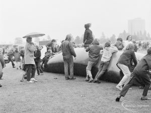 Dagenham Town Show 1972 at Central Park, Dagenham, showing children jumping onto and around the giant inflated tube, 1972