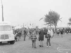 Dagenham Town Show 1972 at Central Park, Dagenham, showing marquees, ice cream van and members of public on rainy day, 1972