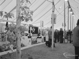 Dagenham Town Show 1972 at Central Park, Dagenham, showing Burma Star and other stands, including display with garden and tree, in marquee with white roof, 1972