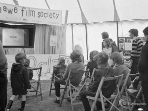 Dagenham Town Show 1972 at Central Park, Dagenham, showing Fanshawe Film Society stand with audience watching back-projection film, 1972