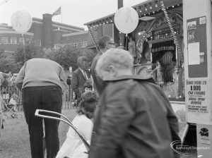 Dagenham Town Show 1972 at Central Park, Dagenham, showing Civic Centre and visitors listening to electric steam organ by entrance, 1972