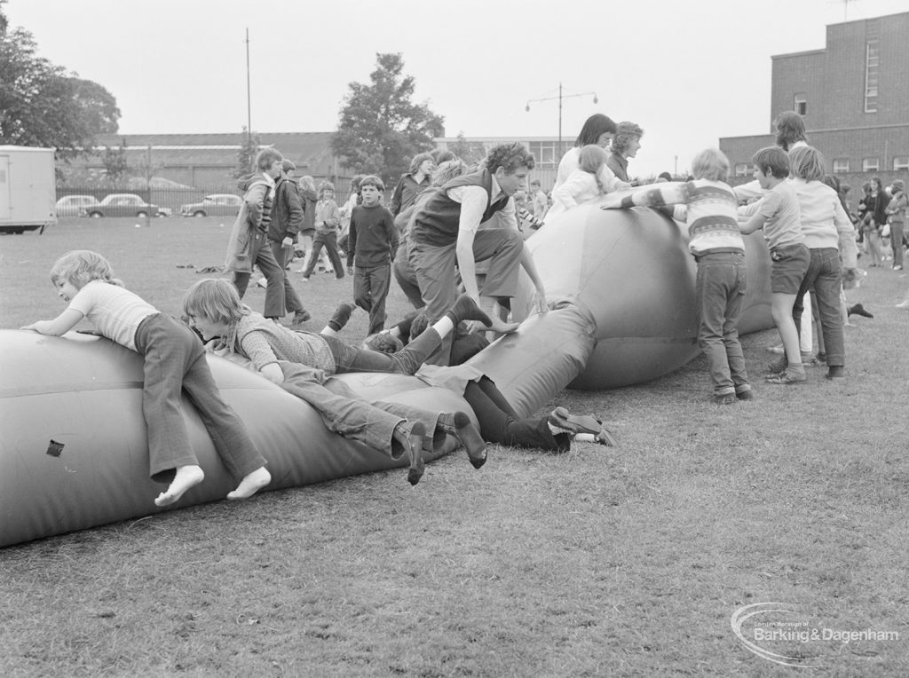 Dagenham Town Show 1972 at Central Park, Dagenham, showing children climbing on giant inflated tube, 1972