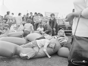 Dagenham Town Show 1972 at Central Park, Dagenham, showing children playing and reclining on intertwined inflated tubes, 1972