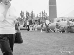 Dagenham Town Show 1972 at Central Park, Dagenham, showing children playing on giant inflated tube, with Fire Station and marquee in background, 1972