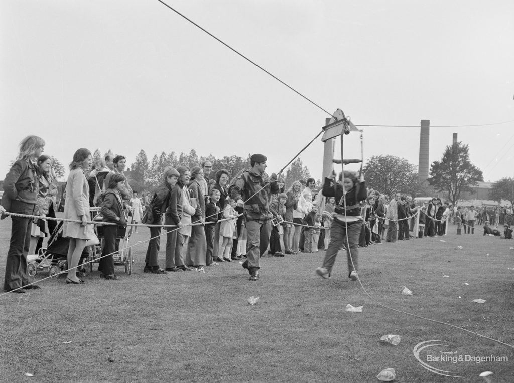 Dagenham Town Show 1972 at Central Park, Dagenham, showing passenger landing at end of Parachute Regiment zip wire, 1972