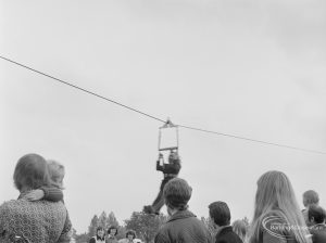 Dagenham Town Show 1972 at Central Park, Dagenham, showing passenger descending on Parachute Regiment zip wire, 1972