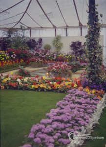 Dagenham Town Show 1972 at Central Park, Dagenham, showing an official floral display with mauve border and pond beyond, 1972