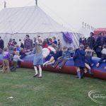 Dagenham Town Show 1972 at Central Park, Dagenham, showing children playing on giant inflated tube, 1972