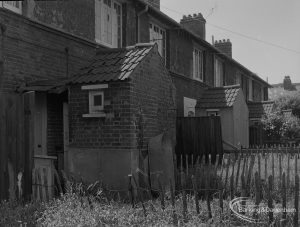 Old Barking, showing rear of houses in Howard Road, with bath hanging from wall and looking south-west, 1973