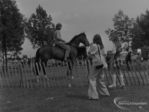 Dagenham Town Show 1973 at Central Park, Dagenham, showing Horse Trials with girl photographing rider in paddock, 1973