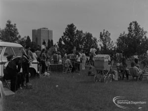 Dagenham Town Show 1973 at Central Park, Dagenham, showing Horse Trials with corner of the paddock, with riders, pram and standing and seated visitors, 1973