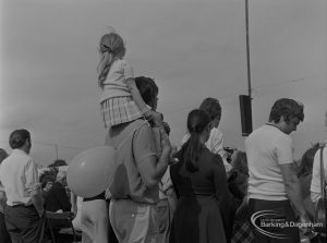 Dagenham Town Show 1973 at Central Park, Dagenham, showing watching spectators including father with daughter on shoulders, 1973