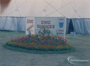 Dagenham Town Show 1973 at Central Park, Dagenham, showing London Borough of Barking Civic Services name plate and flowerbed outside marquee, 1973