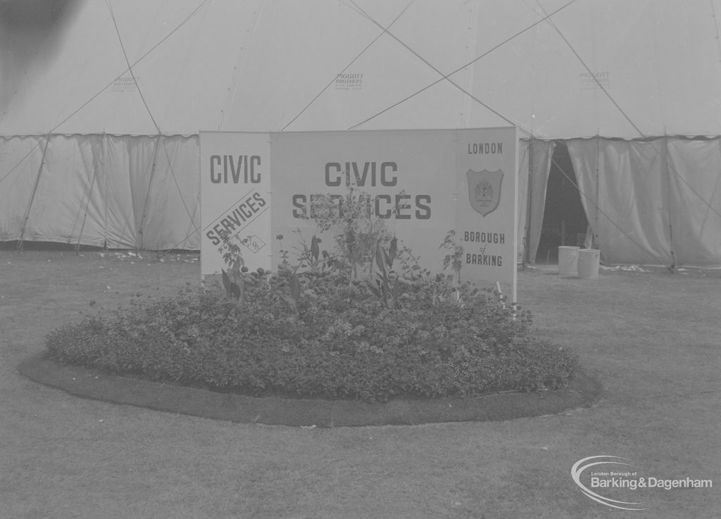 Dagenham Town Show 1973 at Central Park, Dagenham, showing London Borough of Barking Civic Services name plate and flowerbed outside marquee, 1973