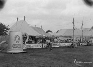 Dagenham Town Show 1973 at Central Park, Dagenham, showing Beer Marquee with visitors sitting and drinking, and large ‘Whitbread Tankard’ and other signs, 1973