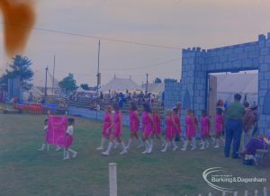 Dagenham Town Show 1973 at Central Park, Dagenham, showing group of girls wearing pink dresses and entering arena to give performance, 1973