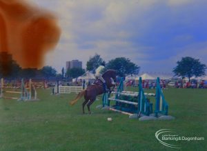 Dagenham Town Show 1973 at Central Park, Dagenham, showing Horse Trials, with competitor jumping bars, 1973