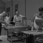 Welfare for the Blind, showing blind craftsmen and others working in carpentry shop, 1973
