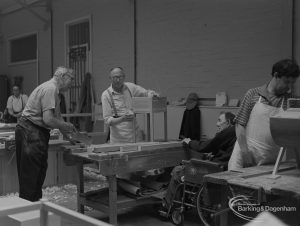 Welfare for the Blind, showing blind craftsmen and others working in carpentry shop, 1973