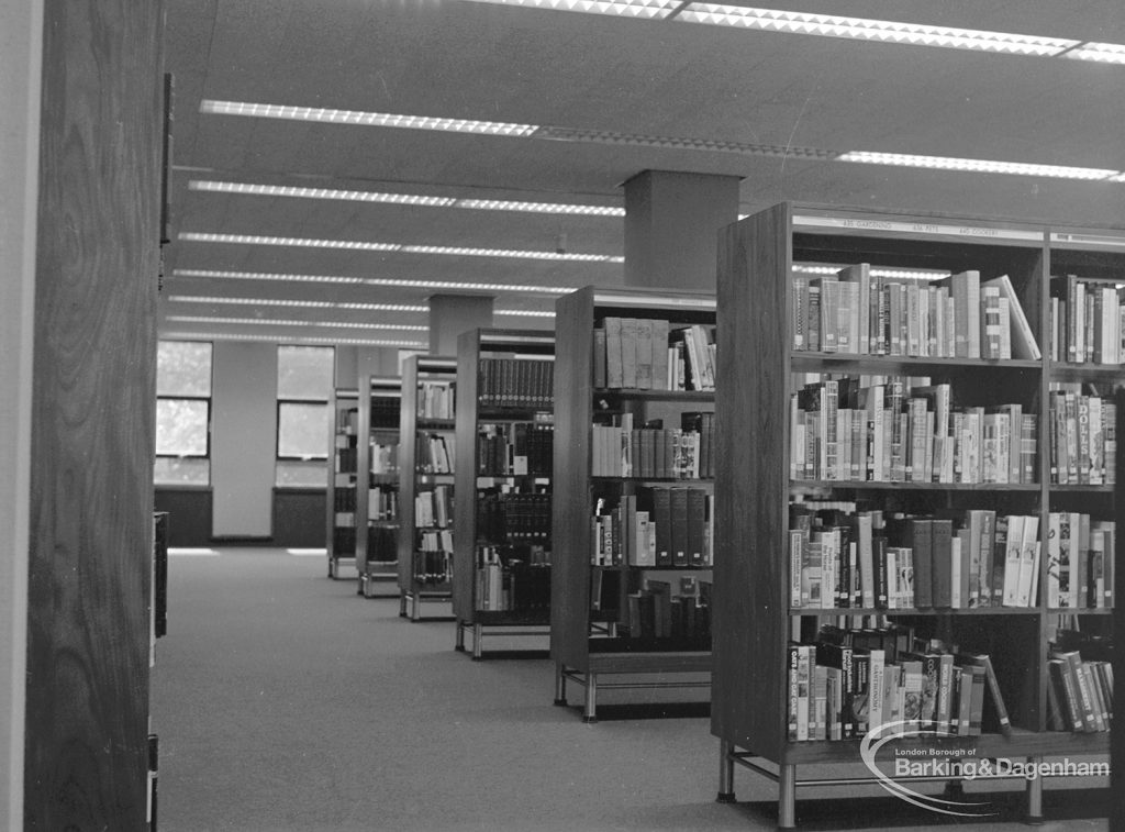 New Barking Central Library, Axe Street, Barking, showing six book stacks in Reference section, 1974