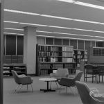 New Barking Central Library, Axe Street, Barking, showing bookcases, table and armchairs in Reference section, 1974