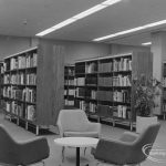 New Barking Central Library, Axe Street, Barking, showing bookcases, table and armchairs in Reference section, 1974