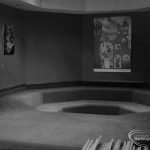 New Barking Central Library, Axe Street, Barking, showing dimly lit storytime cave with seating well in Children’s section, 1974