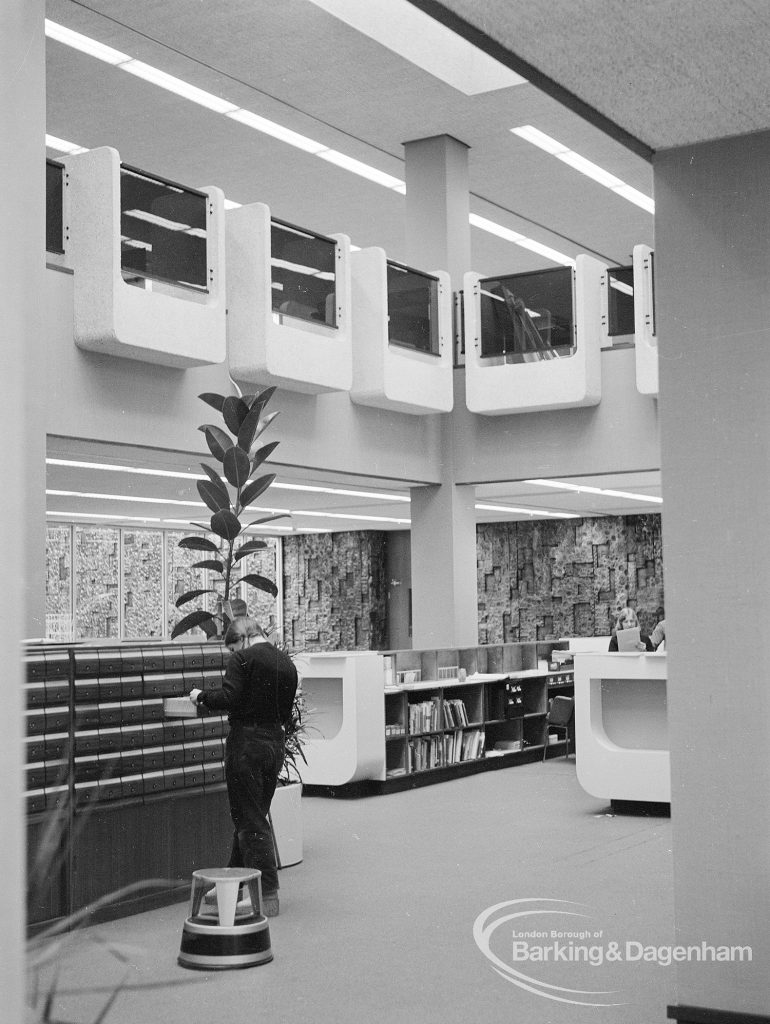 New Barking Central Library, Axe Street, Barking, showing Lending section with catalogue, counter, and view to first floor and ceiling, 1974